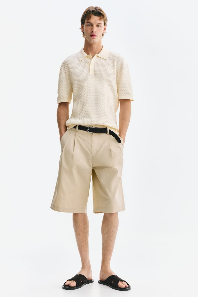 H&M Knitted cotton polo in Cream